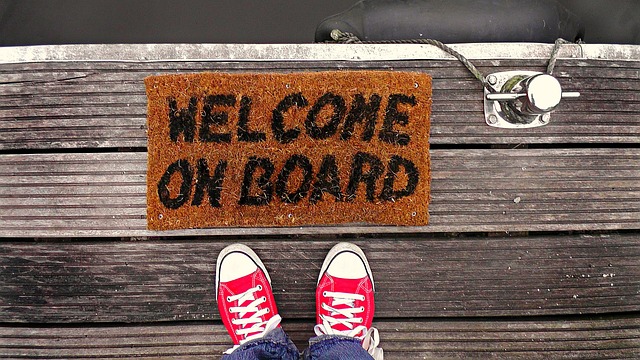Labeled bird food box on welcome mat