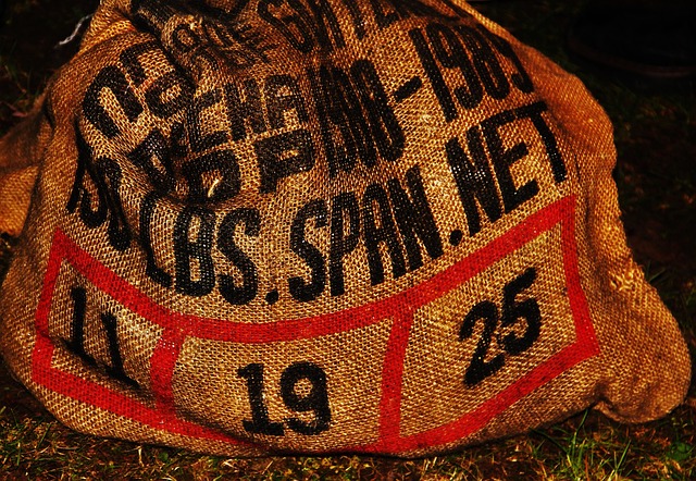 Bird seed being poured from sack