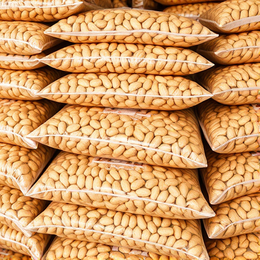 Bulk bags of peanuts stacked neatly