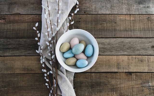 Colourful bird food mix in wooden bowl