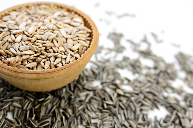 Variety of seeds in wooden bowl